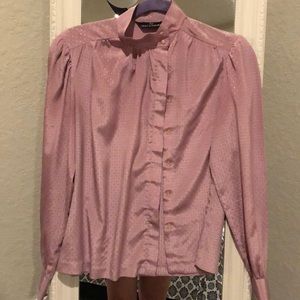 Long sleeved, collared blouse.